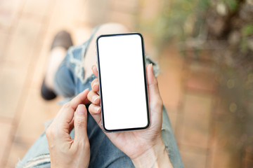 Mockup image blank white screen cell phone.man hand holding texting using mobilebackground empty space for advertise text.people contact marketing business,technology 