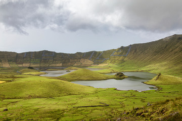 Afternoon clouds above the lakes inside the Corvo Crater on the island of Corvo in the Azores, Portugal.