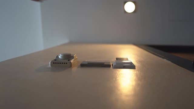 Down view hand holding key card insert box card for open and close system in room