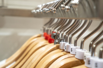 Close up clothes hangers on rack. Background for fashion retail shop shop and apparel store.