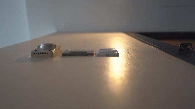 Down view hand holding key card insert box card for open and close system in room