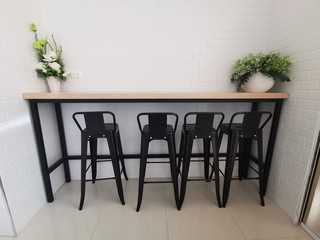 Wooden table and chair set in black On a white background