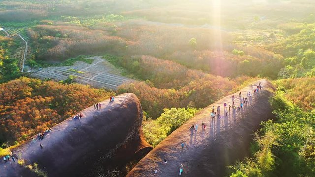 Tourists come to watch the sunrise at 3 Whale's Rock in Bueng Kan Province, Thailand