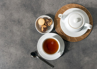 White porcelain tea cup and teapot, Afternoon tea table setting