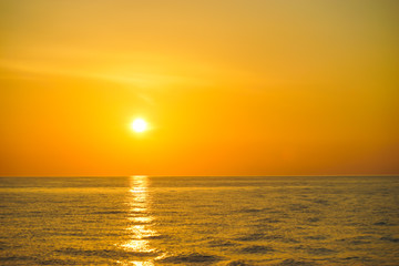 Fototapeta premium Golden sunrise and golden sea at north andaman . Sunrise over the sea near Similan Islands National Park, Phang Nga Province, Thailand, Asia.