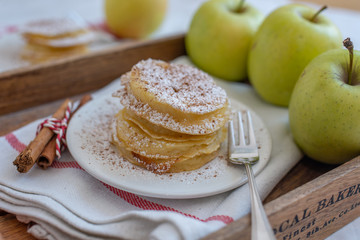Fried pancakes filled with ripe autumn apples