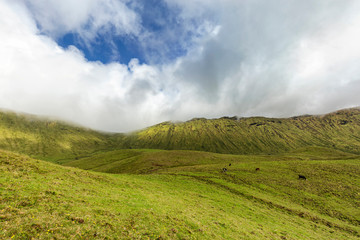 Fototapeta premium Clouds move into the the Corvo caldera on the island of Corvo in the Azores, Portugal.