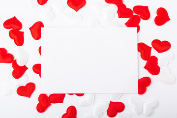 Concept of  romantic card mockup (valentines) for Valentines day. Template blank greeting card and envelope to the wedding. A sheet of paper among red and white hearts. Flat lay, copy space for text