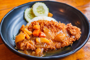 Crispy fried pork cutlet with curry and rice.