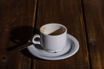 Cup of fresh tea and spoon