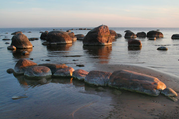 Stone coast of the Baltic Sea at sunrise