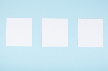 Paper notes composition on blue background. Flat lay.