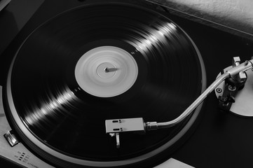 Vintage record player with vinyl record for background