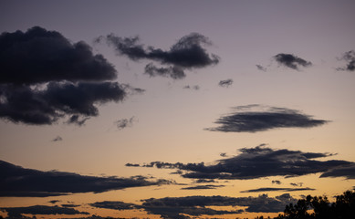 Sunrise clouds. Dramatic magical sunset over orange cloudy sky