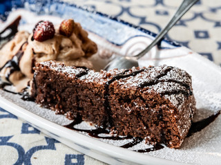 slice of tasty chocolate caprese dessert with hazelnut mousse with strawberry