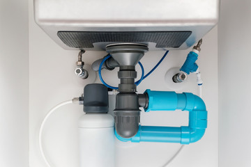 under sink plumbing and drainage system, water purification system install under modern kitchen...