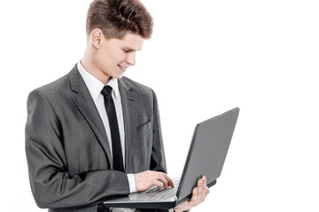 confident young businessman with a laptop .isolated on a white