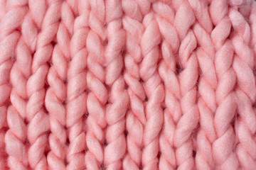 pink fabric of giant merino yarn for arm knitting background