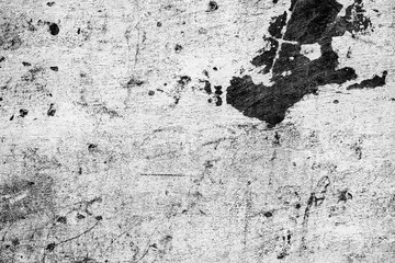Texture of a concrete wall with cracks and scratches which can be used as a background