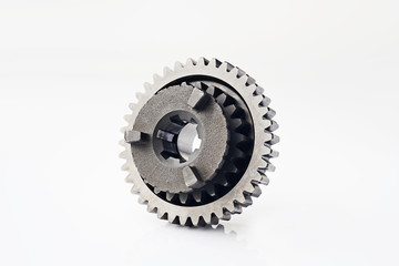 Motorcycle part. Old metal gear wheel or pinion part , Motorcycle Gear driven gear reduction ratio  isolated on white background.