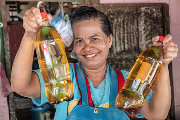 elderly Asian women and used oil