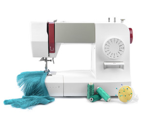 Modern sewing machine on white background
