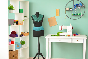 Interior of modern atelier with tailor's workplace