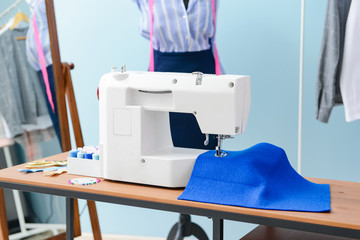 Tailor's workplace in modern atelier