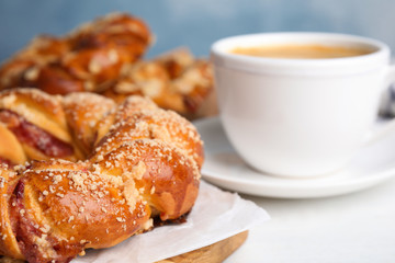 Delicious pastries and coffee on white table, closeup