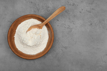 Flour on light grey background, top view. Space for text
