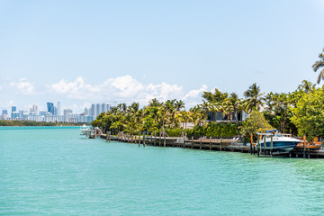 Bal Harbour, Miami Florida with light green turquoise ocean Biscayne Bay Intracoastal water and cityscape skyline of Sunny Isles Beach