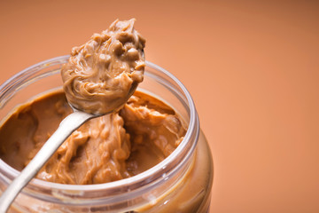 Spoon with peanut butter