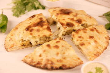 Stuffed naan desi pizza with Chicken herbs vegetables and Cheese