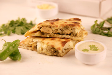 Stuffed naan desi pizza with Chicken herbs vegetables and Cheese