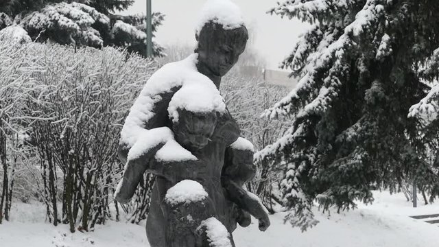 statue in the snow , Gorky Park in Moscow in winter
