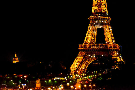 Paris, FRANCE - MAY 27, 2015: Eiffel Tower in Paris at night with illumination. The Eiffel tower is the most visited monument of France with about 6 million visitors every year.