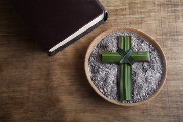 Ash wednesday, crucifix made of ash, dust as christian religion. Lent beginning
