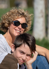 Fototapeta premium Portrait of a mother with her child outdoors