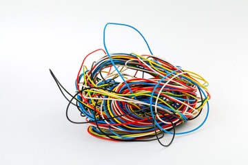 harness of power electrical wires of different colors on the white background of the table