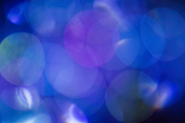 Blue abstract blurred shiny glitter lamp lights background.
