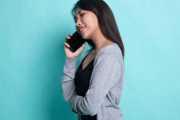 Young Asian woman talking with mobile phone.