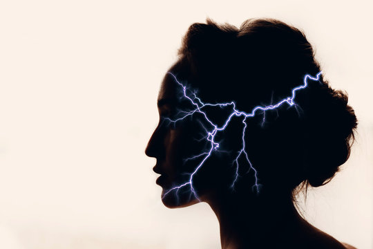 Silhouette of woman with lightning in head. Medicine concept.