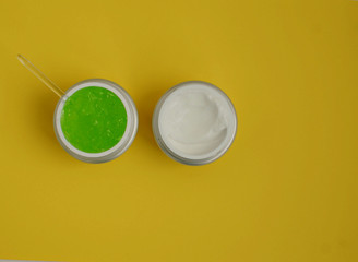 aloe gel mask, face cream on a yellow background, close-up
