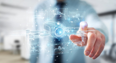 Businessman holding and touching holographic drone projection in his hands 3D rendering