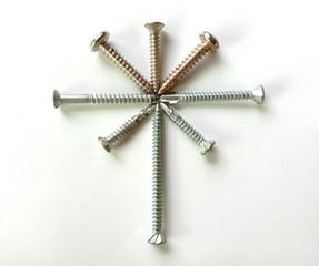 Bolts and nuts hardware tools isolated on white background closeup.