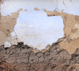 the brick is old painted and the paint