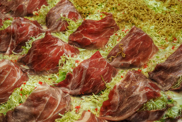 Okonomiyaki preparation with ham and lettuce