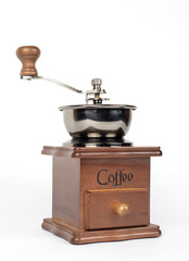 Manual coffee grinder on a white background.