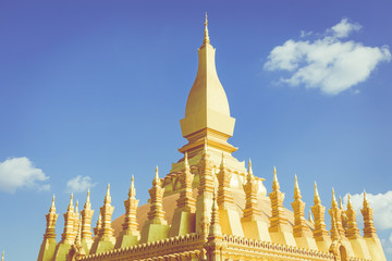 Naklejka premium Pha That Luang temple - The Golden Pagoda in Vientiane , Laos