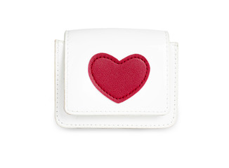 A close-up heart shape on a white lady bag, isolated from a white background